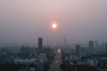 Fototapeta premium Hazy urban skyline at dawn with a glowing ring from lens flare created by AI generation