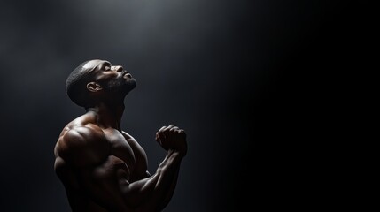 Powerful athlete posing in dramatic lighting intense emotional expression studio setting inspirational concept