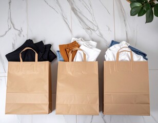 Shopping bags filled with clothes on marble floor