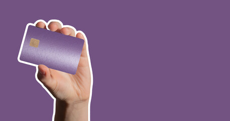 Banner background with hand holding purple bank card with chip. Concept of finance, payment,