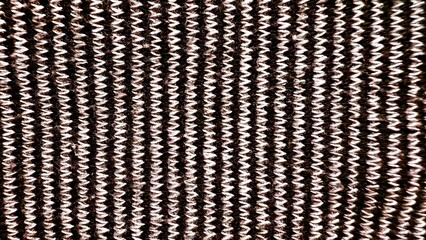 textured black and white knitted fabric pattern closeup with bold vertical stripes ideal for...