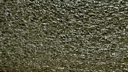 metallic silver crumpled foil texture with reflective creases and intricate folds in macro close up for modern wallpaper or luxury design background