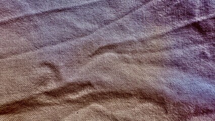 subtle purple textured fabric with soft creases ideal for wallpaper or editorial use