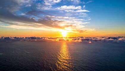 Fototapeta premium Aerial sunset over ocean clouds
