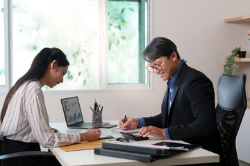Car Dealership. A friendly consultation between a client and a salesperson.
