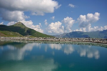 panorama of the Swiss Alps and lake in summer 