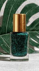 Nail polish with golden cap, against Monstera leaf, sits on a concrete surface, bathed in sunlight, casting shadows