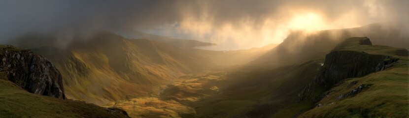 A dramatic, moody landscape with rolling hills, enveloped in fog, and illuminated by a burst of golden light