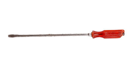 A used flat head screwdriver with a red handle isolated black.