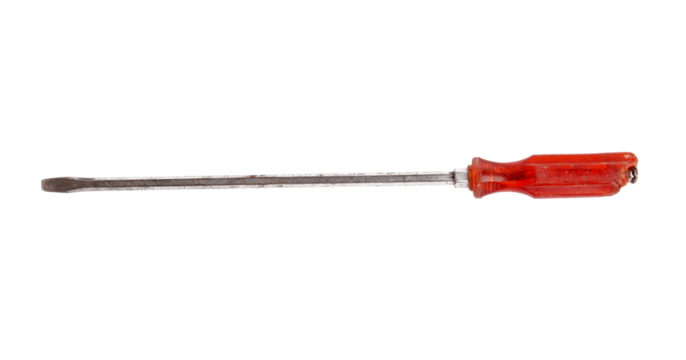 A used flat head screwdriver with a red handle isolated black.