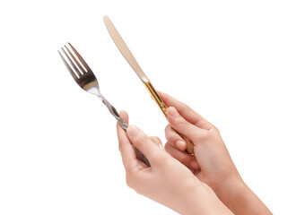 Hands holding elegant gold and silver cutlery, ready for a fine dining