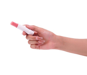 Womans hand holding a pink lip balm stick, .