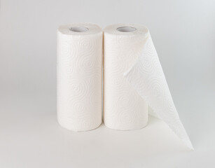 two rolls of paper towels on a white background