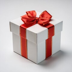 A white gift box tied with a red and gold ribbon sits on a clean white background in a square composition
