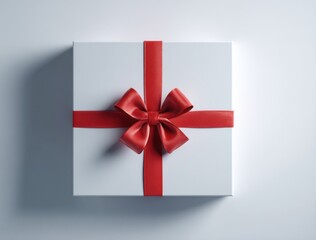 A simple white gift box with a red ribbon tied in a bow, casting a soft shadow on a plain background