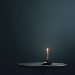 Simple composition a candle burning on a round table against a dark, blurred background. Lighting is soft