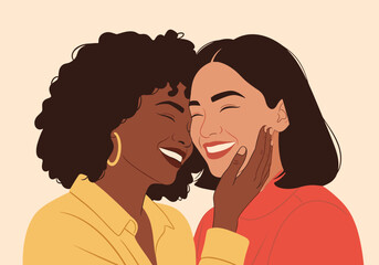 Two happy diverse women sharing a joyful moment of friendship and connection in a warm embrace