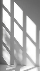 Geometric shadow pattern cast on a white wall by sunlight filtering through a window, creating a minimalist and abstract design