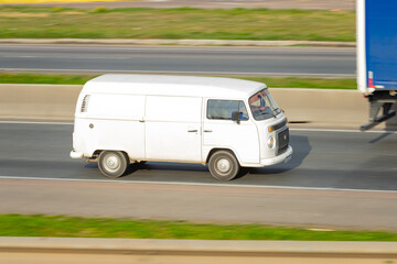 Retro on the Run: Vintage Van Meets Modern Highway