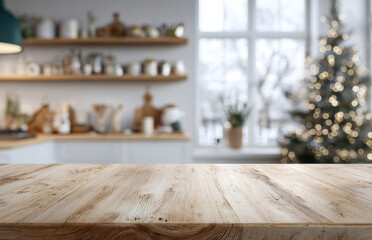 Empty wooden board on a table with a blurred kitchen interior and a Christmas tree in the background