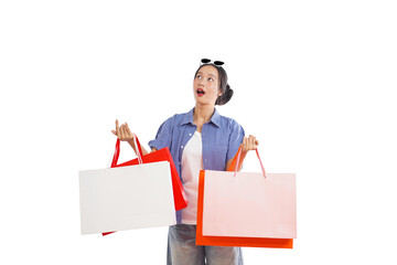 Shopping Spree Excitement: A fashionable woman, clutching colorful shopping bags, gazes upwards in...