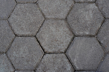 Close-up of hexagonal concrete pavers, ideal for backgrounds or urban texture.