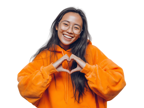 Happy girl showing love and care with hand gesture. Kindness, charity concept.