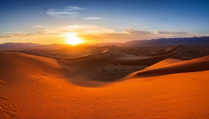 Fototapeta premium sunrise over a desert landscape of orange sand dunes