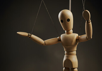 Wooden mannequin figure controlled by strings conceptual image