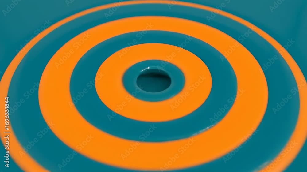 Poster abstract teal and orange concentric circles - close-up view of three vibrant orange concentric circl