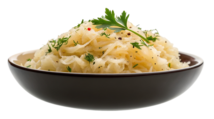 Delicious homemade sauerkraut in a bowl garnished with fresh herbs on a white background isolated