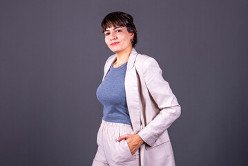 Elegant young businesswoman with her hand in her pocket