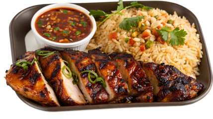 Grilled chicken with fried rice and spicy sauce for delicious culinary experience at home