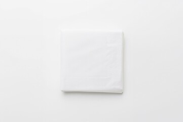 Top view of pristine paper napkins on a white surface