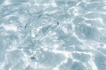 Obraz premium Blurred transparent water surface with bubbles and splashes, soft and clear texture. Modern abstract natural backdrop with sunlight reflections and space for text.