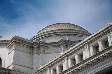 Classical Dome Architecture Against Blue Sky.
