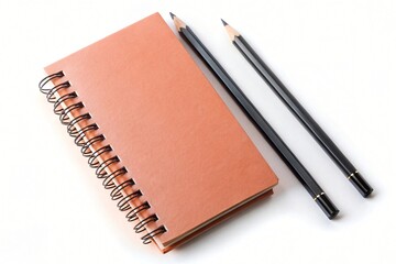 Naklejka premium Spiral bound notebook with blank orange cover two black pencils nearby