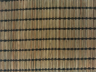 A woven texture of a brown basket