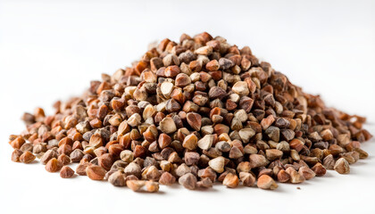 Fototapeta premium Buckwheat seeds in pile, showcasing their unique shape and texture against white background. These seeds are often used in cooking and health foods, adding nutritional value