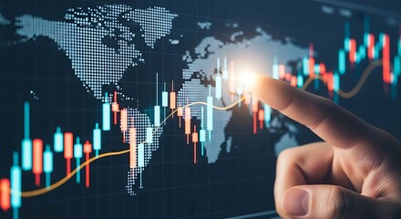 Close up of a finger touching a glowing digital world map overlayed on a stock market trading chart with rising and falling candlesticks representing financial data and global economy