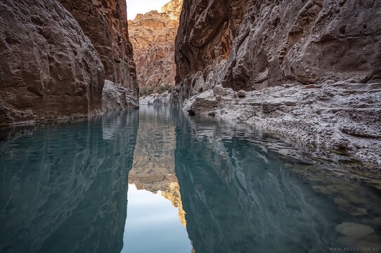 Thermal Spring Pools Mirroring in a Remote, Craggy Canyon - Soothing Desert Waters Experience