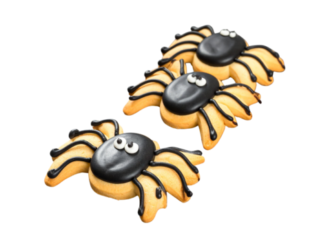 Angled Side Perspective of Black Widow Spider Cookies with Glossy Icing and Long Legs, Creepy Sweet Treat, Dark Background