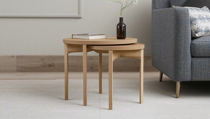 Two-tiered nesting tables crafted from pale wood, showcasing a modern minimalist style that maximizes space and adapts to various living spaces.