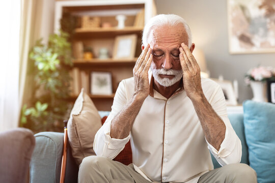 Stress, headache and senior man in home with worrying, overthinking or mental health. Anxiety, mistake and elderly male person with migraine in living room for regret, vertigo or brain fog in house.
