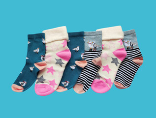 Bright children's multi-colored socks with decorative pattern, top view	