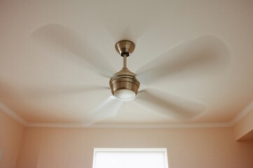Rotating ceiling fan with natural motion blur effect