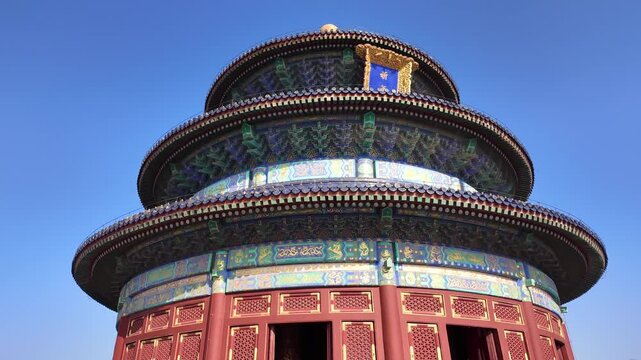 Circular view of the top of the Temple of Heaven in Beijing, China, highlighting the architectural details and colorful roof design of the historic landmark. Beijing, China - 11/20/2024