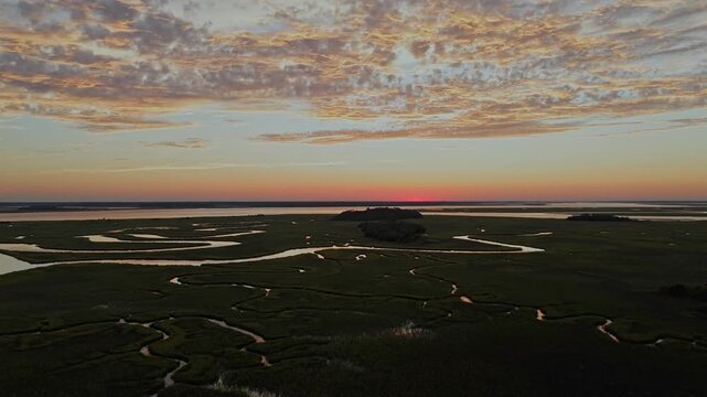 Aerial Video of Clouds reflecting off the tidal creeks in the marsh Seabrook Island, SC
