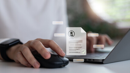 Using a laptop with a digital resume profile hologram, verification check mark, and rating stars,...