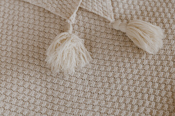 Close up brown cotton rug with tassels edge.